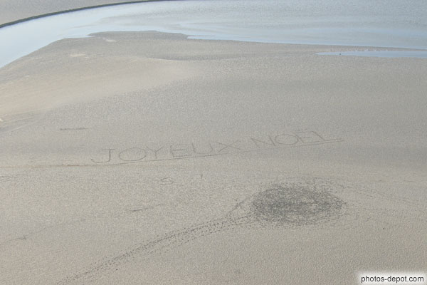 photo de Joyeux Noel écrit sur le sable...