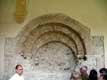 Ancien portail roman aux triples voussures et corbeau ouvragés, Abbaye de Lagrasse