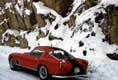 Ferrari 250 GT trois-quart arrière sur route enneigée